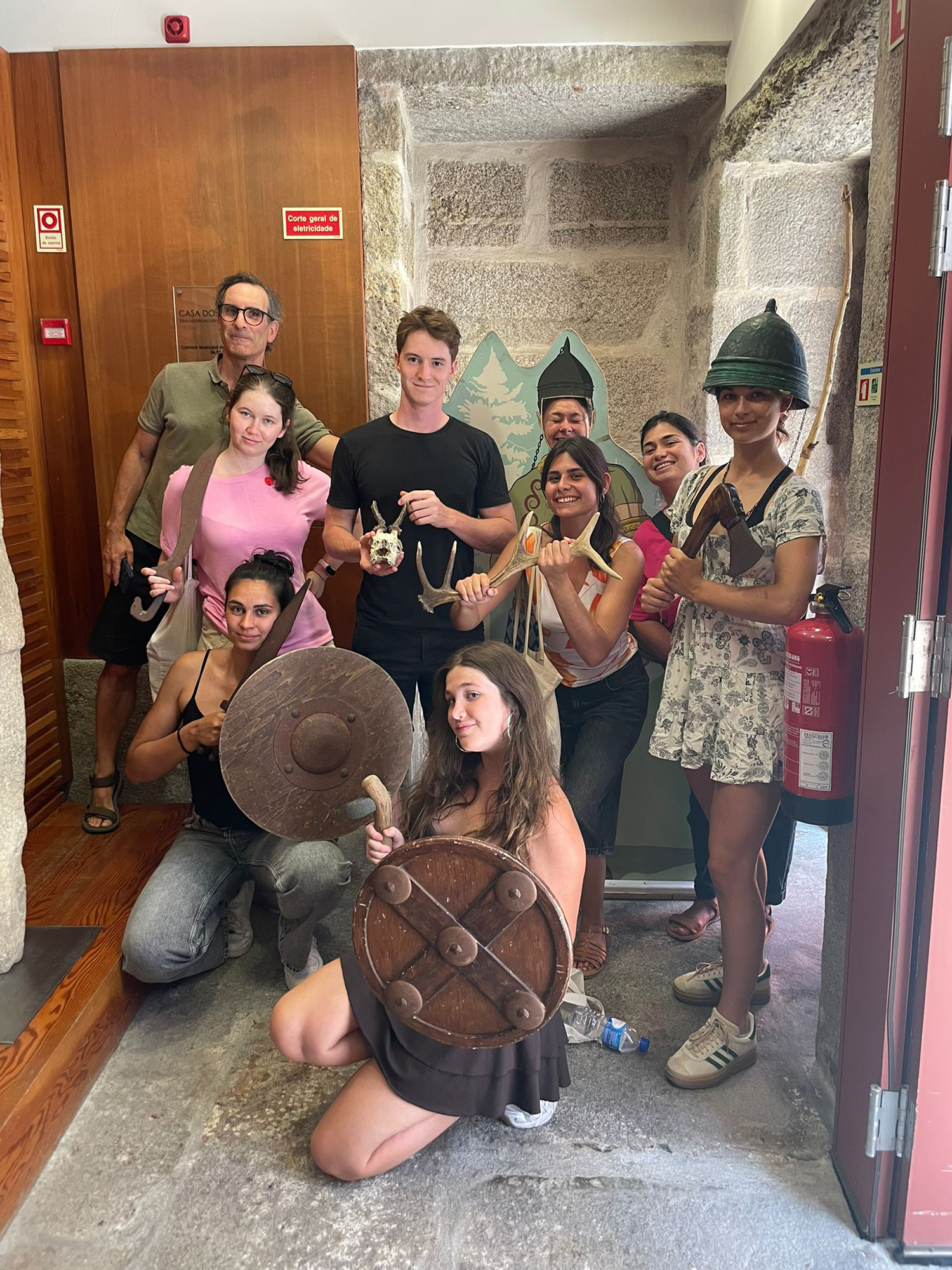 Volunteers at Casa dos Nichos Museum discovering Roman history through replicas of armour and tools, connecting past and present. Volunteers at Casa dos Nichos Museum discovering Roman history through replicas of armour and tools, connecting past and present.