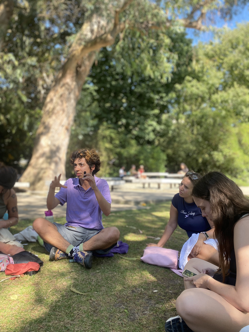 A participant reflects during the conversation, highlighting how volunteering experiences shape understanding of society, identity, and community. A participant reflects during the conversation, highlighting how volunteering experiences shape understanding of society, identity, and community.