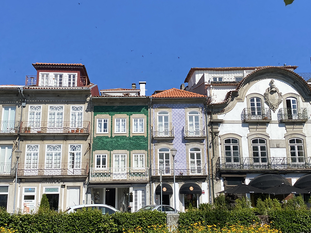 Colourful buildings and local atmosphere in a Portuguese coastal town reflecting an authentic travel experience