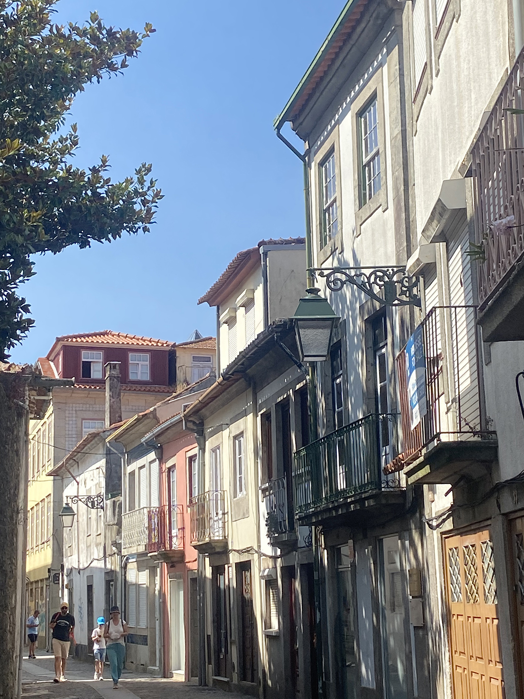 Local street with traditional buildings and everyday life in Viana do Castelo showing an authentic destination experience