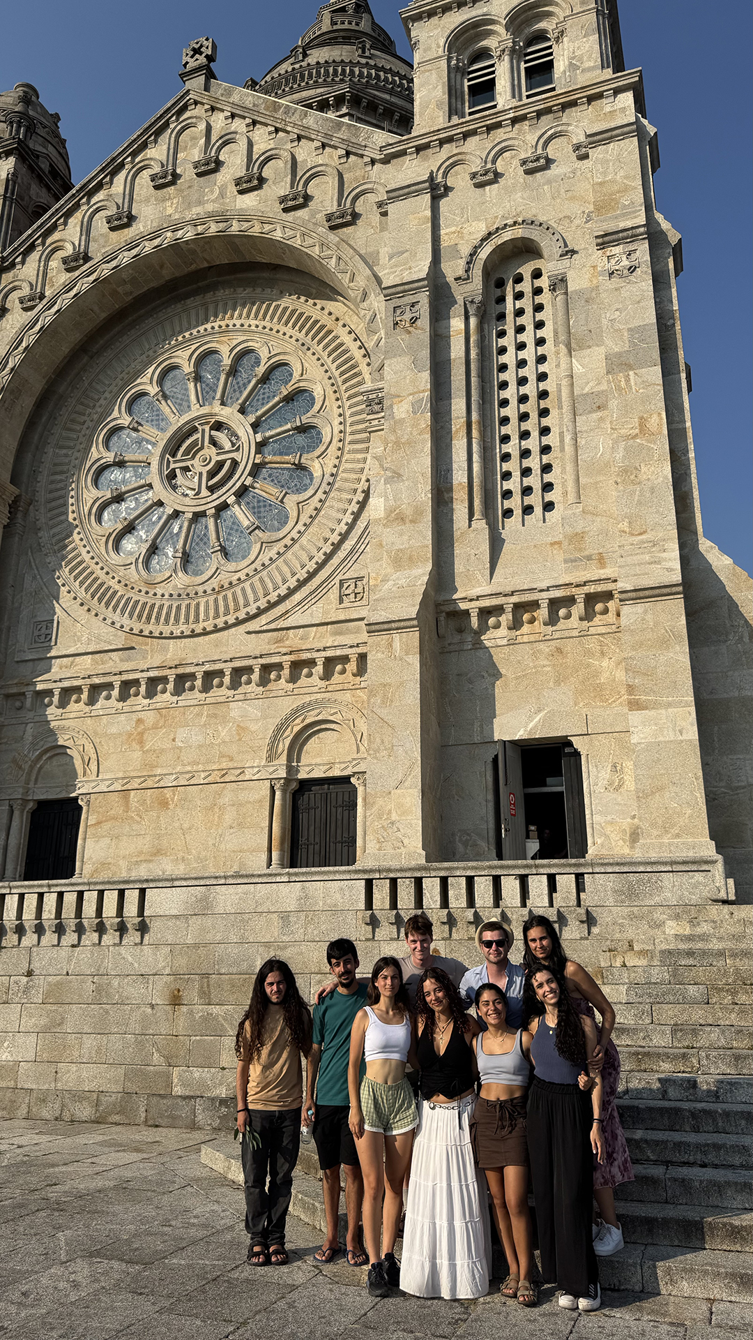 Group of young travellers exploring a cultural heritage site in Portugal through sustainable and responsible travel